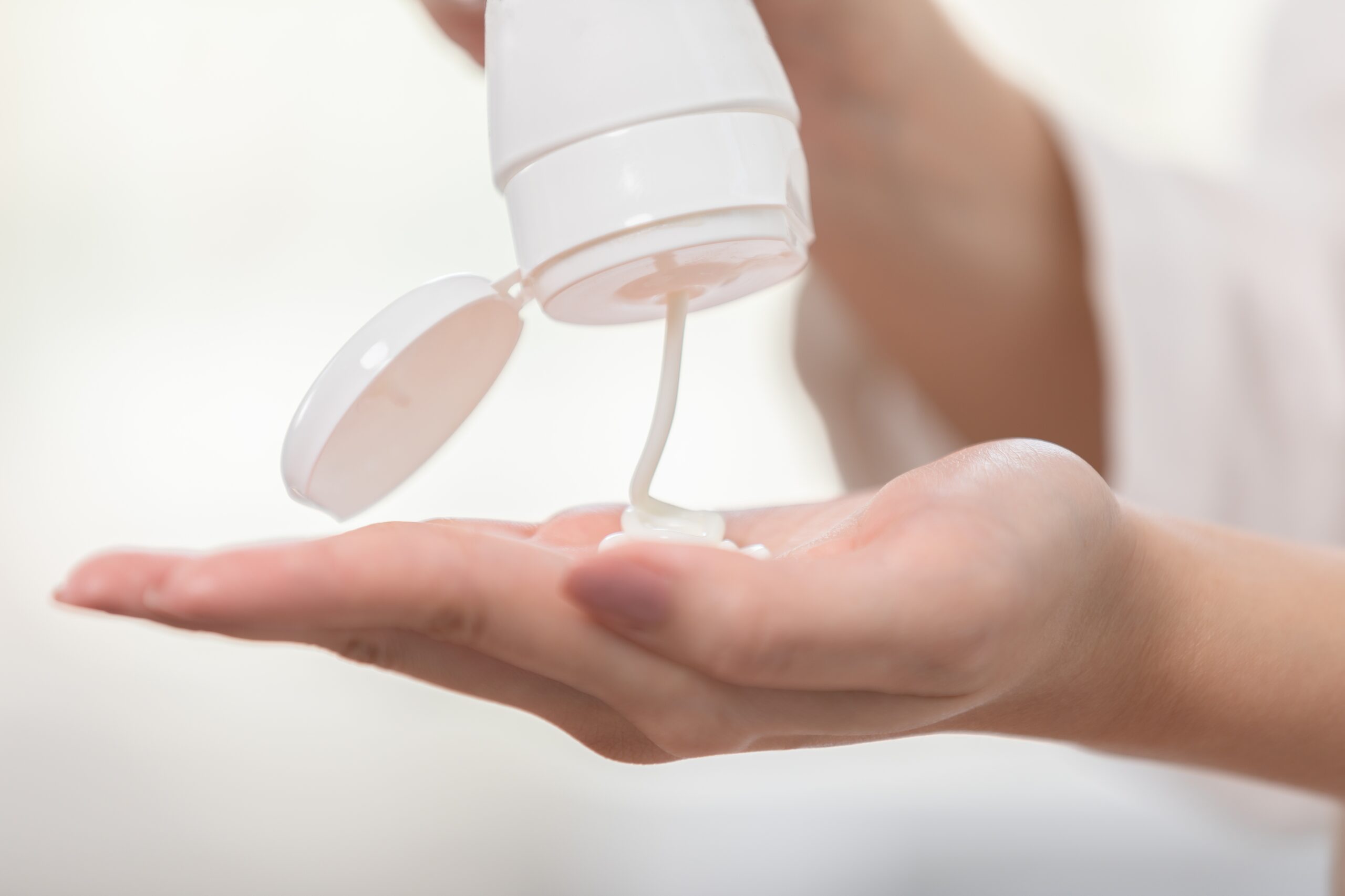 man's hand holding lotion getting ready for Jerk off instructions